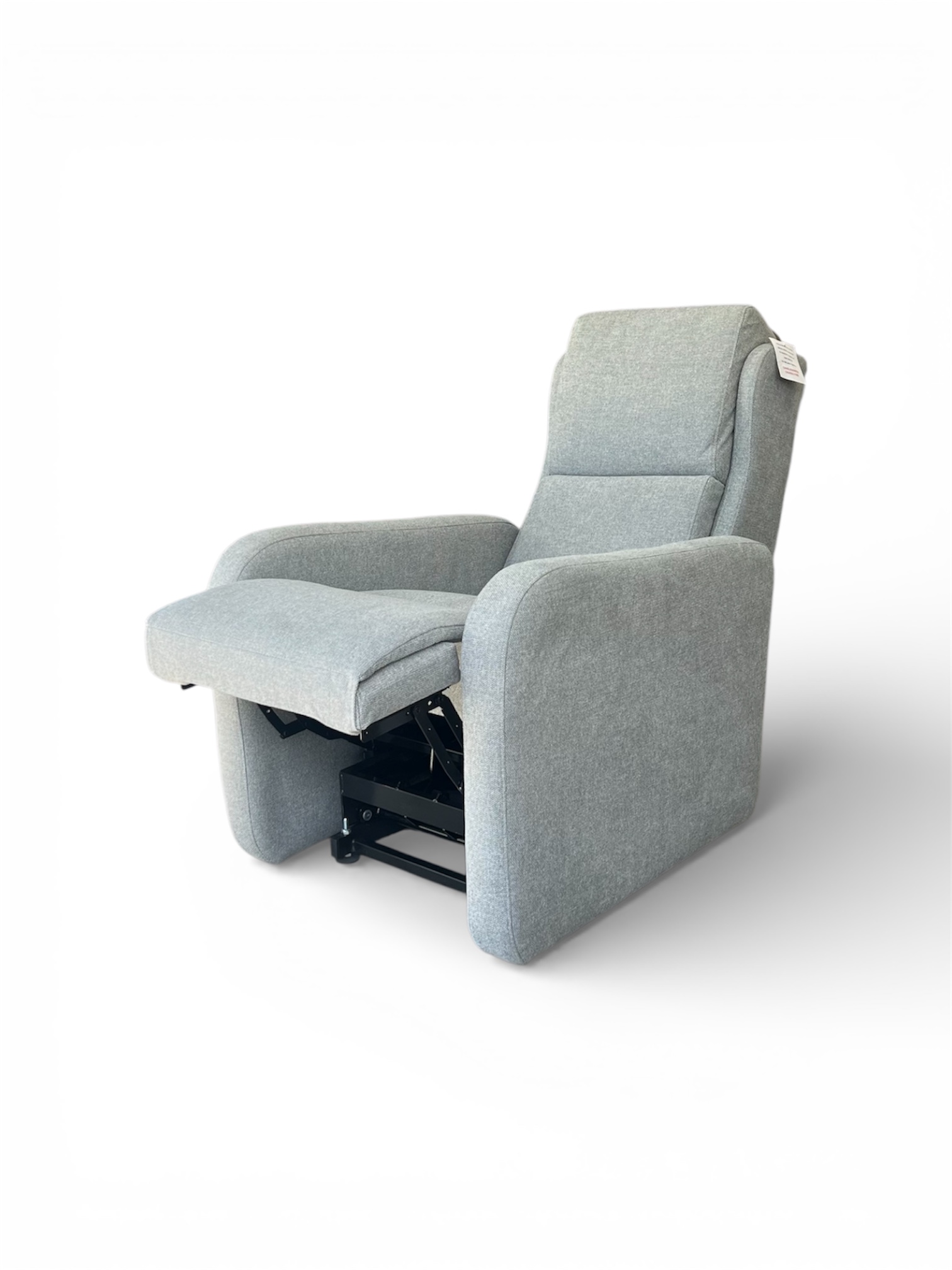The Buxton chair in grey fabric with the leg lift elevated
